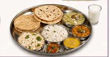 A home-style Manorath Foods thali with rotis, rice, dal and sabzi